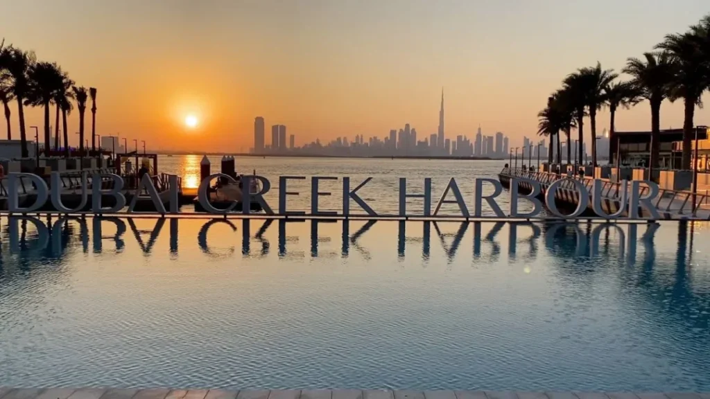 Creek Dhow Cruise during sunset with dinner setup on Dubai Creek