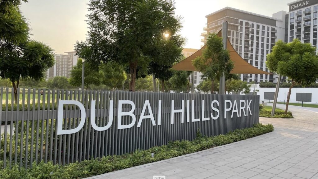 › Forever Tourism LLC Children and families enjoying Gardens and Playgrounds Near Dubai on a sunny day with greenery and Dubai skyline in the background.
