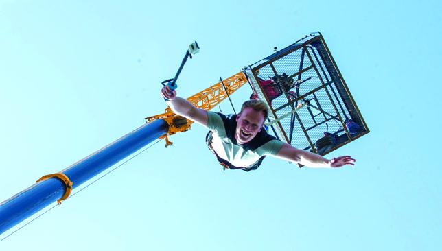 Bungee jumping in Dubai for beginners from a crane with desert skyline in background