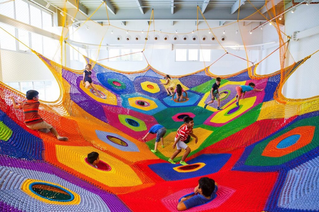 Children playing in top-rated playgrounds for kids in the UAE, surrounded by safe, modern play structures.