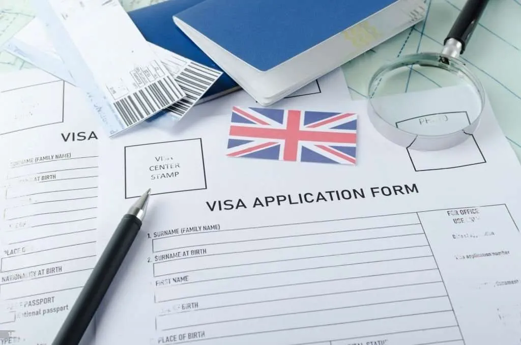 Travel documents and passport prepared for visa to UK from Dubai, showing checklist of UK visa requirements and application process.