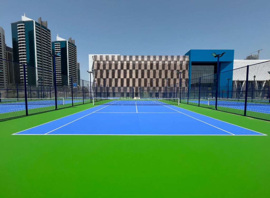 Modern outdoor Padel Tennis court in Dubai with skyline in the background