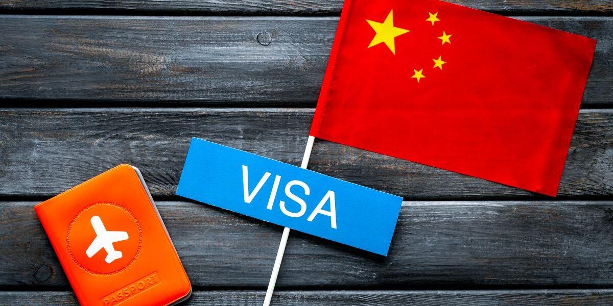 Traveler holding passport during China visa application in Dubai – guide for visa to China from Dubai and China tourist visa from Dubai.