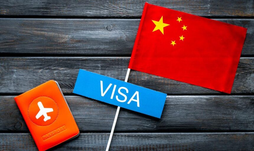 China Visa from Dubai | #2025 Guide + Hacks | Easy Approval! › Forever Tourism LLC Traveler holding passport during China visa application in Dubai – guide for visa to China from Dubai and China tourist visa from Dubai.
