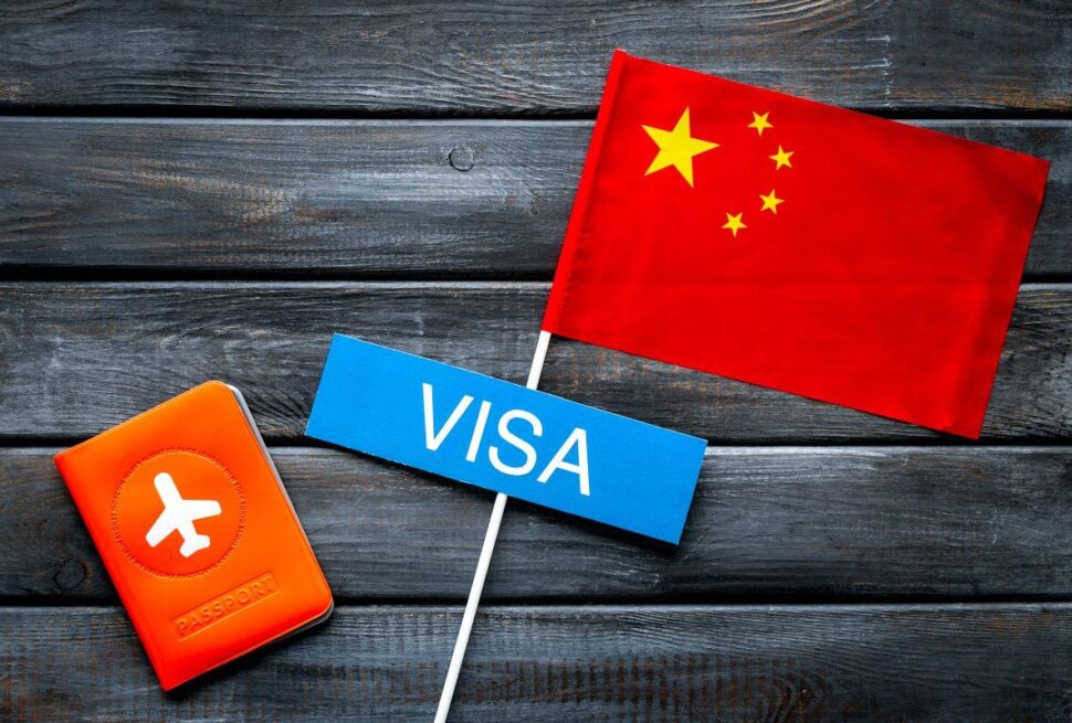 Traveler holding passport during China visa application in Dubai – guide for visa to China from Dubai and China tourist visa from Dubai.
