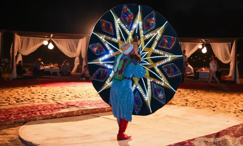 Belly dance desert safari Dubai experience with 4x4 dune bashing, sandboarding, and traditional evening entertainment under the stars
