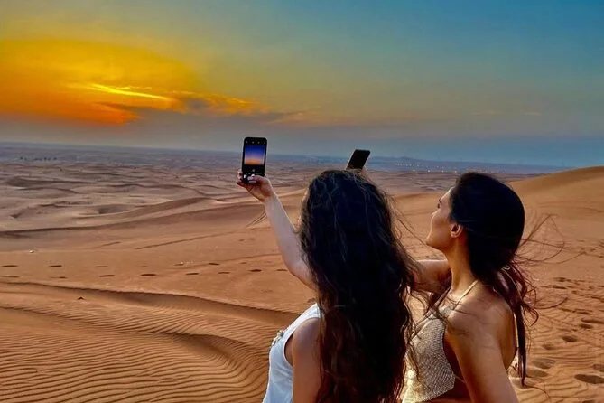 2_dubai-evening-desert-safari-with-transfers-dune-bashing-dinner › Forever Tourism LLC Scenic Desert Safari pictures featuring dune bashing, camel rides, and sunset views over the golden Dubai desert.