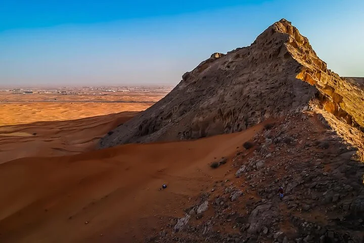 Evening safari sunset over hidden desert dunes in Dubai
