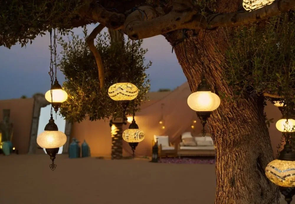 Dubai desert background featuring golden sand dunes, clear blue skies, and a peaceful Arabian landscape perfect for scenic inspiration.