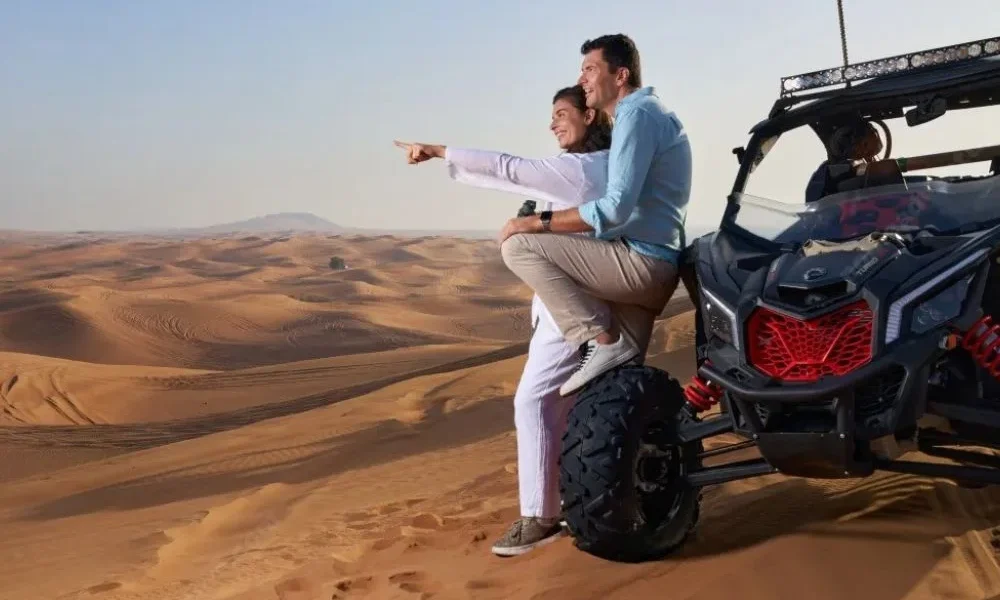 Golden sunrise illuminating dunes during a Morning Desert Safari Tour in Dubai