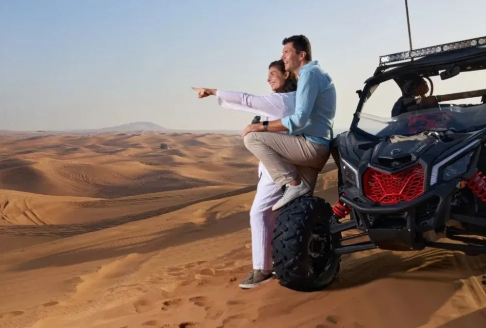 Golden sunrise illuminating dunes during a Morning Desert Safari Tour in Dubai