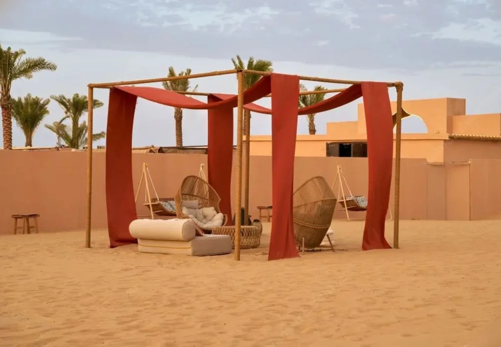 4×4 cresting red dunes at sunset during a desert trip Dubai