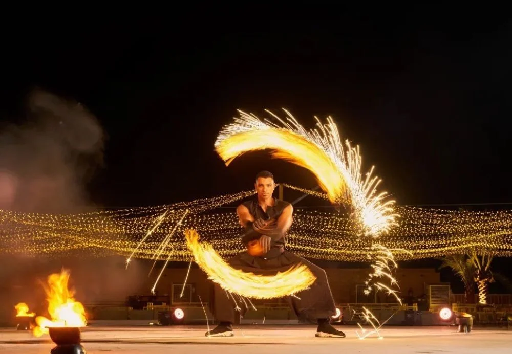Evening desert safari with BBQ dinner and belly dance in Dubai under starry skies