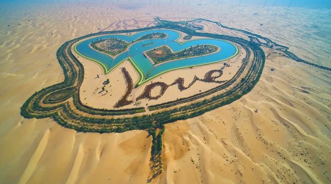 A panoramic view of a popular Dubai Desert Safari location with 4x4 vehicles, sand dunes, and traditional Bedouin camp setup.