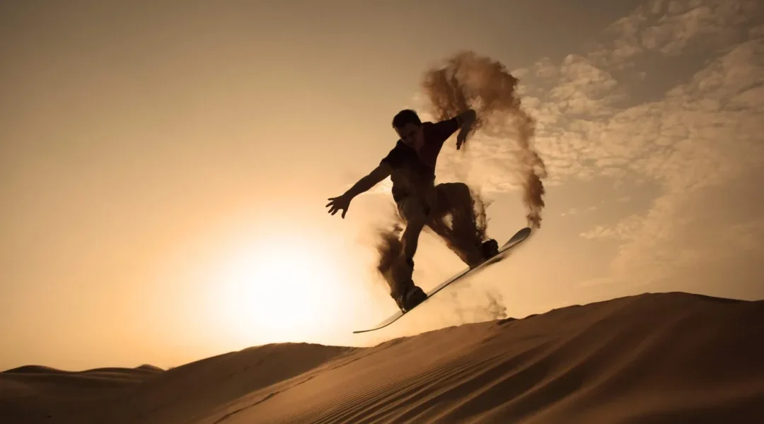 Tourist taking Desert Safari Dubai pictures during golden hour