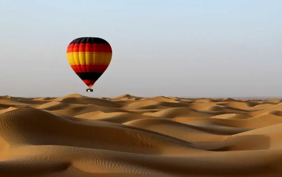 desert safari tours dubai reviews guide with red dunes, 4x4 convoy, and camp lights