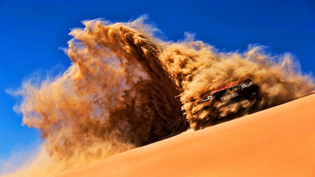 Tourists enjoying desert safari in Dubai with dune bashing ride
