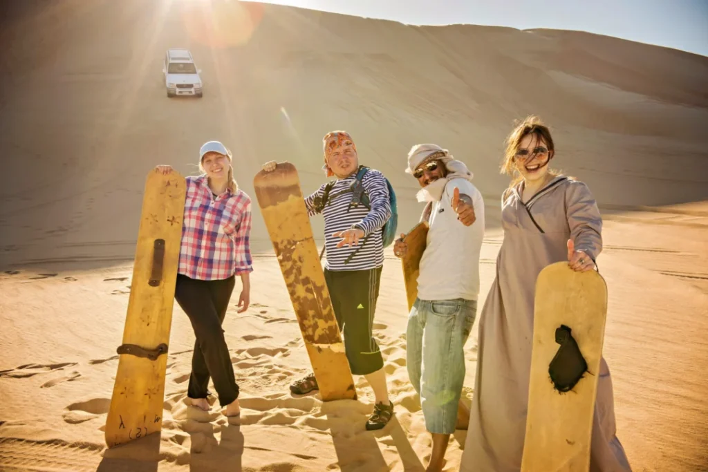 n0eqc9lgvwve36jyemsp8m4mmlt8_1595433474_shutterstock_1071589673 › Forever Tourism LLC Desert camel walking across golden sand dunes during a scenic sunset ride in Dubai