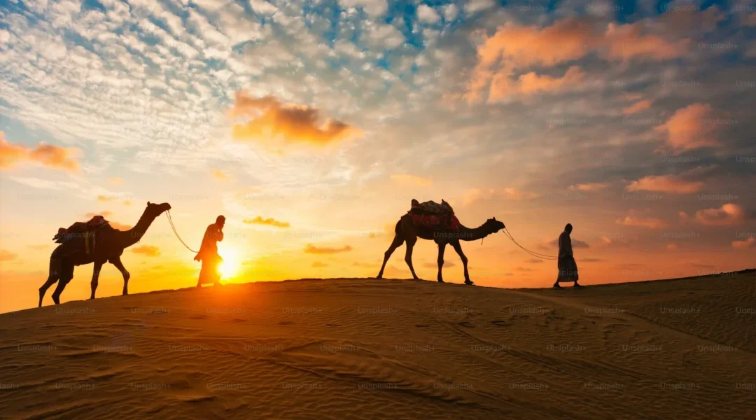 4x4 SUV racing through desert dunes at sunset, representing thrilling experiences and Dune Bashing Dubai cost for tourists