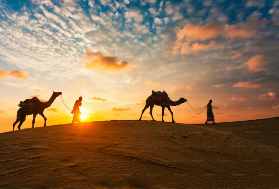 4x4 SUV racing through desert dunes at sunset, representing thrilling experiences and Dune Bashing Dubai cost for tourists