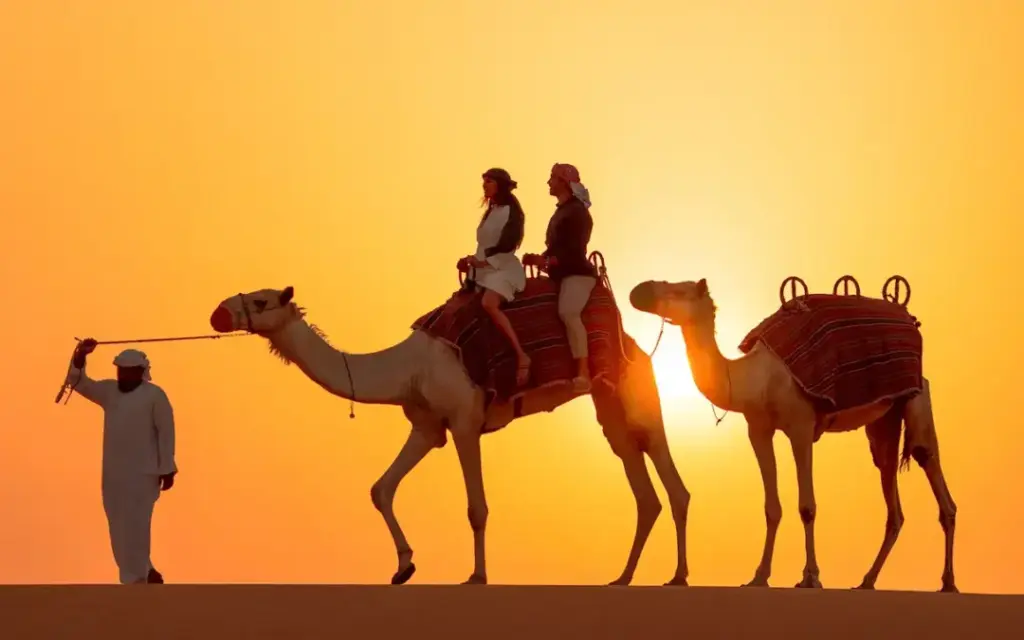 Arabian Tours Dubai with 4×4 on red dunes, camel ride, and lantern-lit camp