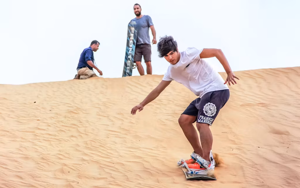› Forever Tourism LLC overnight camp setup in Dubai desert with tents, lanterns, and starry sky