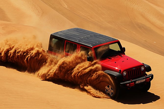 › Forever Tourism LLC UAE Desert red dunes near Dubai at sunset with 4×4 and camel trail
