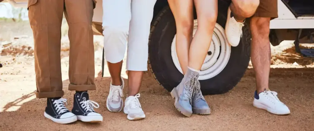 desert safari outfit ideas with breathable layers, hat, scarf, and closed shoes on Dubai dunes