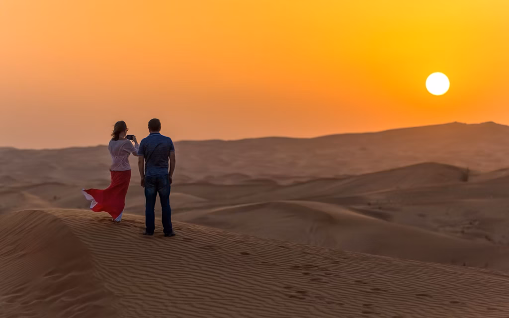 › Forever Tourism LLC Dubai red dune safari 4×4 on red dunes at sunset with camel ride