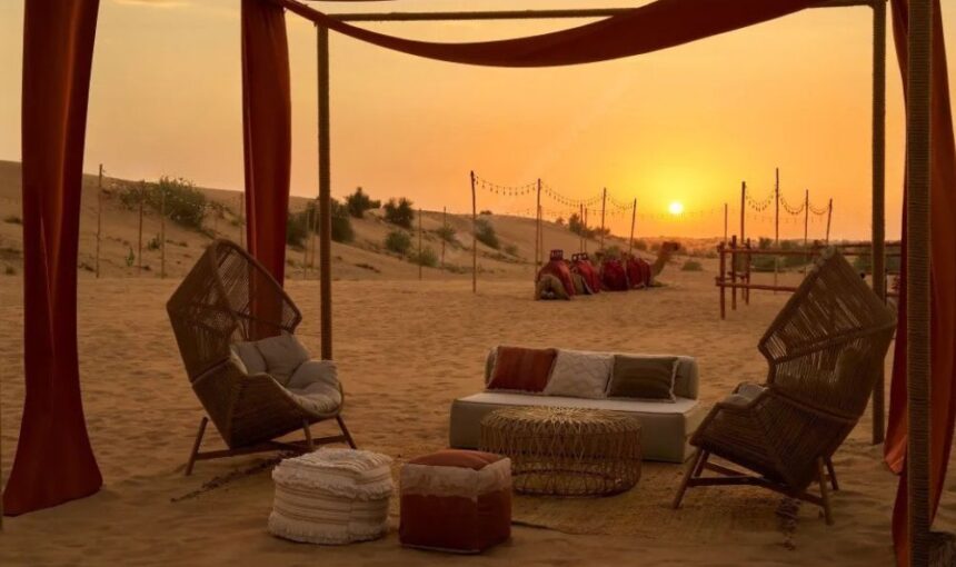 WhatsApp Image 2025-08-28 at 60629 PM › Forever Tourism LLC Cozy lounge seating with traditional décor at Al Khayma Desert Camp Dubai during a stunning desert sunset.