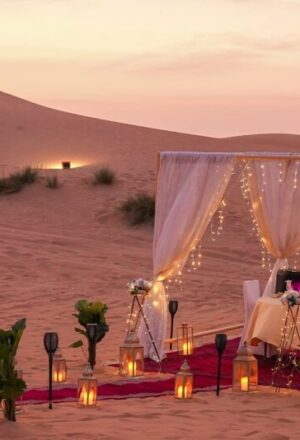 Arabian Tours Dubai with 4×4 on red dunes, camel ride, and lantern-lit camp