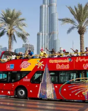Big Bus Tours Dubai hop-on hop-off bus passing Burj Khalifa and Dubai skyline