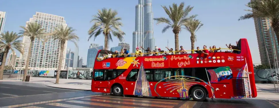 Big Bus Tours Dubai: Routes, Stops & Easy Booking › Forever Tourism LLC Big Bus Tours Dubai hop-on hop-off bus passing Burj Khalifa and Dubai skyline
