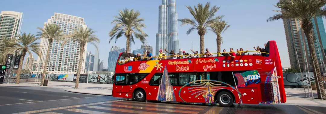 Big Bus Tours Dubai: Routes, Stops & Easy Booking › Forever Tourism LLC Big Bus Tours Dubai hop-on hop-off bus passing Burj Khalifa and Dubai skyline