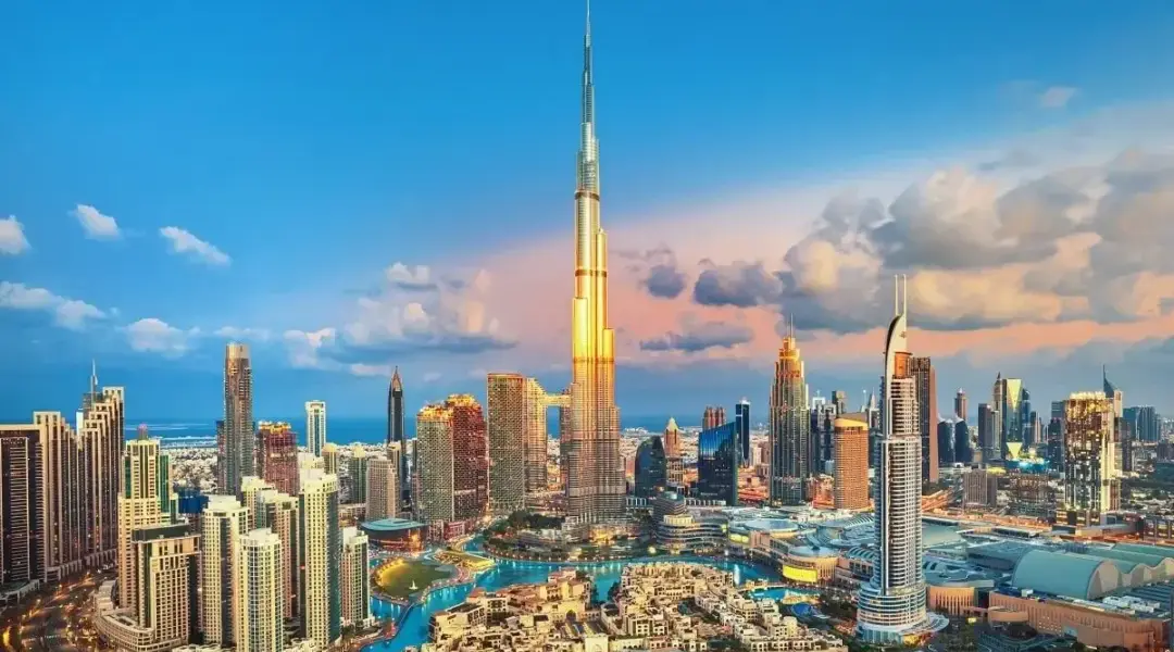 Dubai City Tours: Top Sights, Routes & Easy Booking › Forever Tourism LLC Dubai city tours with skyline view of Burj Khalifa, creek abra, and heritage lanes