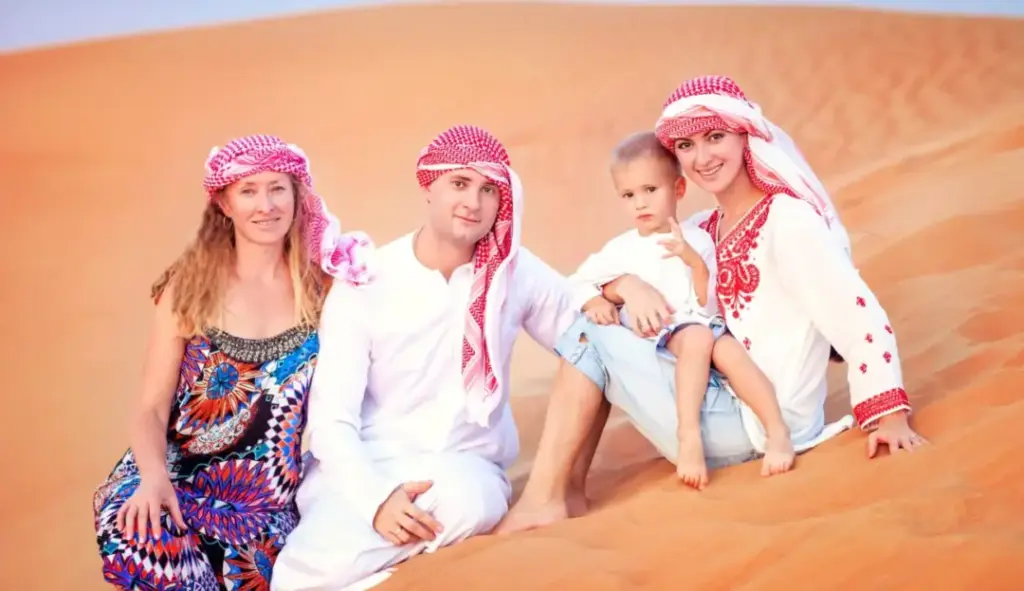 happy family on a package tour holiday with luggage and city and desert in background