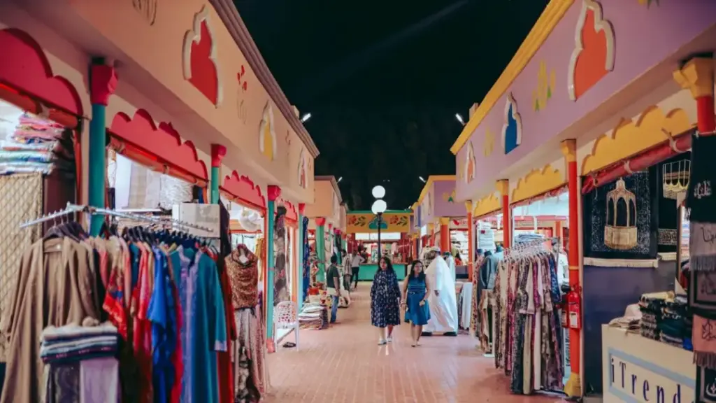 global village online ticket booking for Dubai attraction with pavilions and lights