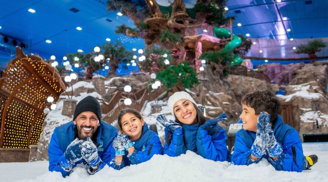 family enjoying UAE holiday 2025 with Dubai skyline and desert in the background