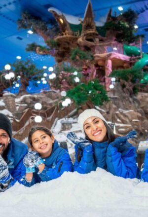 › Forever Tourism LLC family enjoying UAE holiday 2025 with Dubai skyline and desert in the background