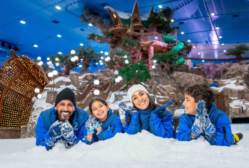 family enjoying UAE holiday 2025 with Dubai skyline and desert in the background