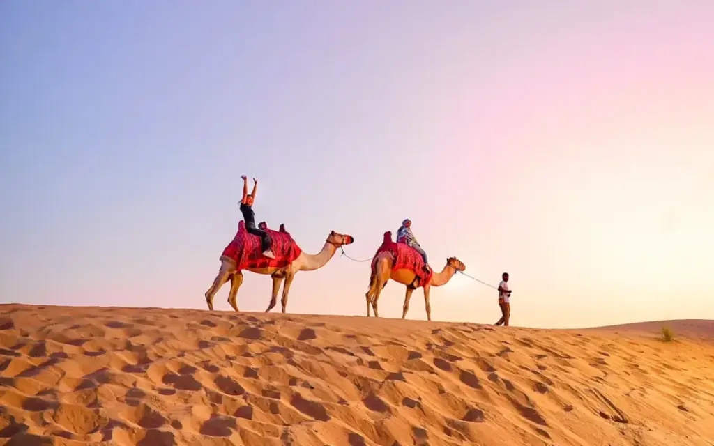 the desert safari Dubai with dune bashing, camel rides, and evening camp