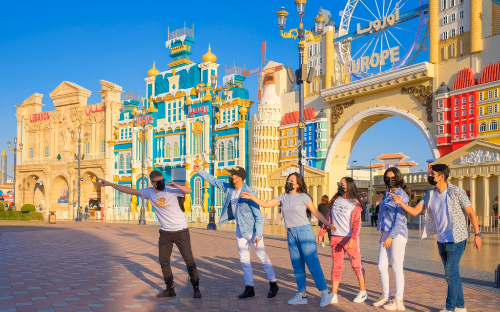 global village online ticket booking for Dubai attraction with pavilions and lights