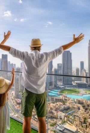 happy family on a package tour holiday with luggage and city and desert in background › Forever Tourism LLC happy family on a package tour holiday with luggage and city and desert in background