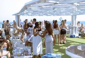 Lotus Cruise Dubai mega yacht dinner with city skyline and guests on deck