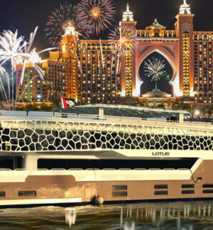 › Forever Tourism LLC Lotus Cruise Dubai mega yacht dinner with city skyline and guests on deck