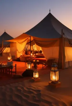 › Forever Tourism LLC desert camping Dubai with tents, campfire, and lanterns under starry sky