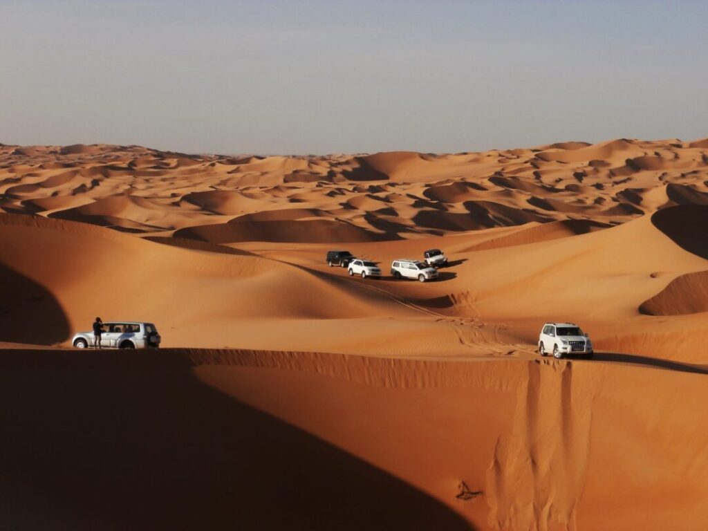 Desert safari self drive experience with 4x4 vehicles exploring golden sand dunes in Dubai