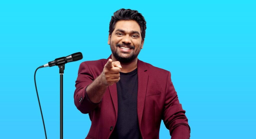 Top Events Dubai Calendar featuring a stand-up comedian performing live on stage in Dubai