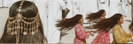 Traditional Middle Eastern dance with girls wearing vibrant dresses and ornate hair accessories