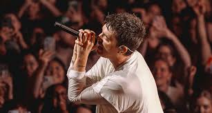 Top Events Dubai Calendar featuring a live singer performing on stage during a major Dubai concert